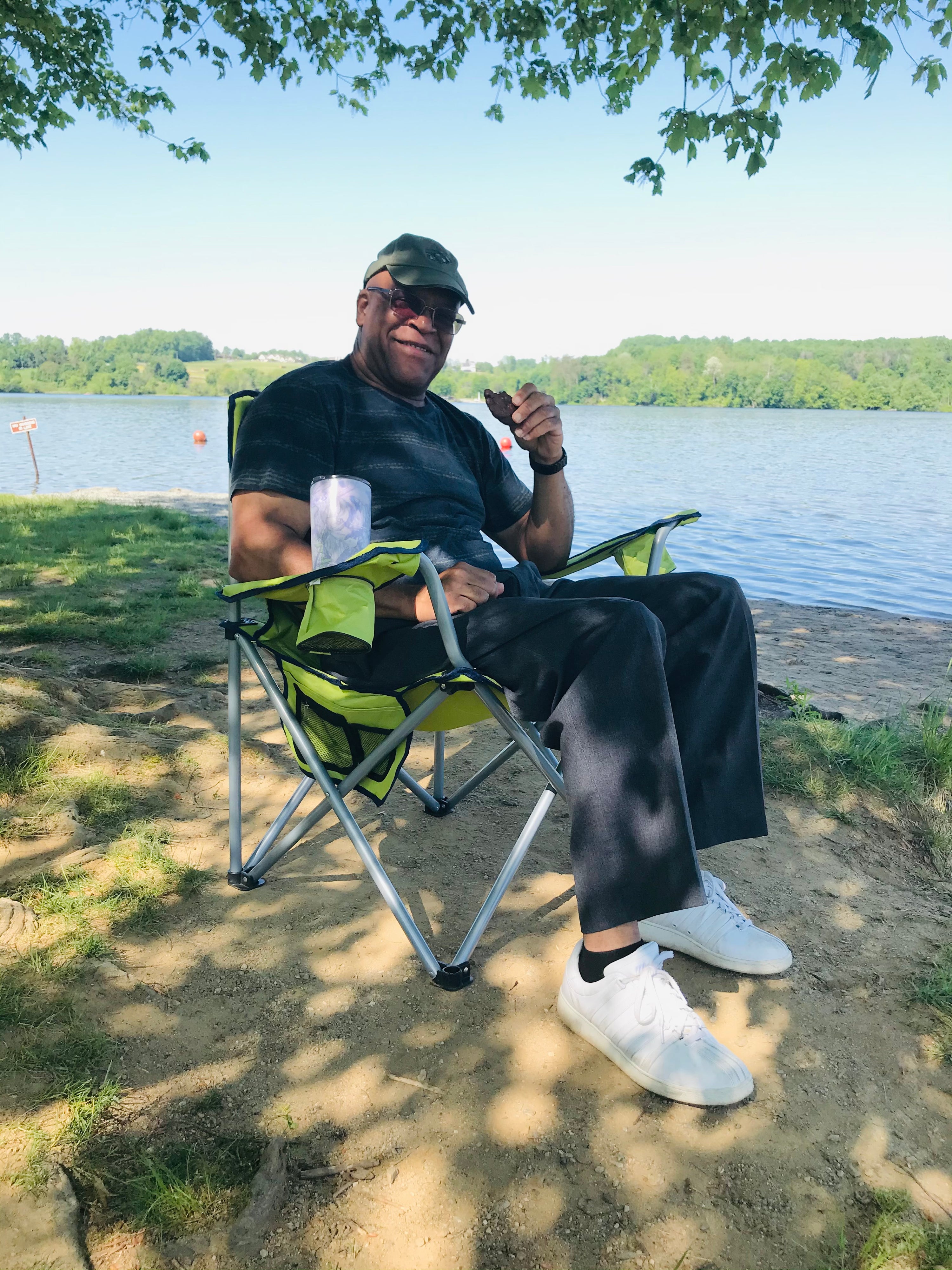 A dad relaxing by the lake enjoying a treat, a Father's Day gift idea from Little Miss Moffitt